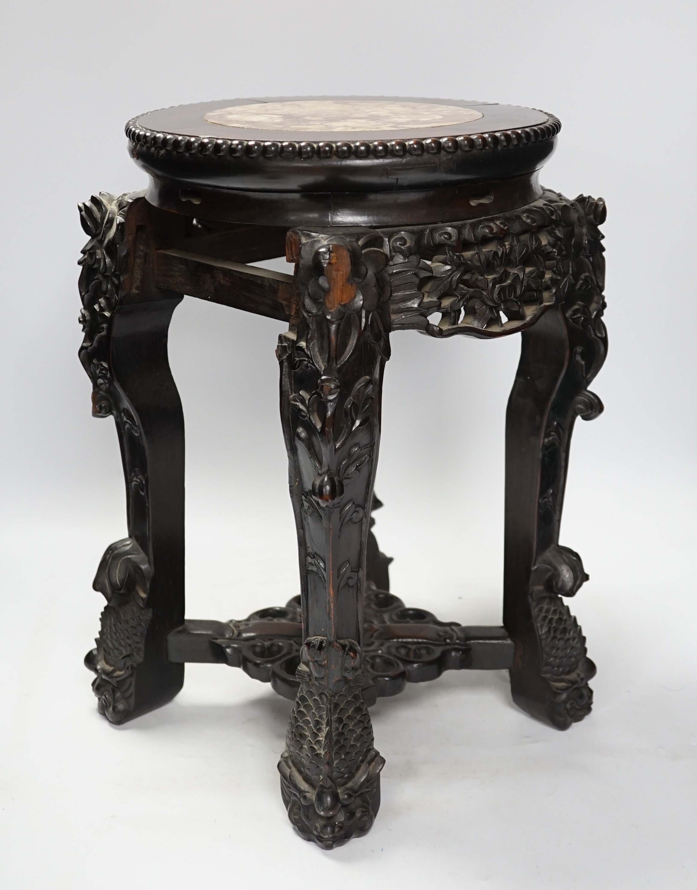 A Chinese hongmu stand, with inset marble top, 42cm high. Condition - poor to fair, section of frieze missing